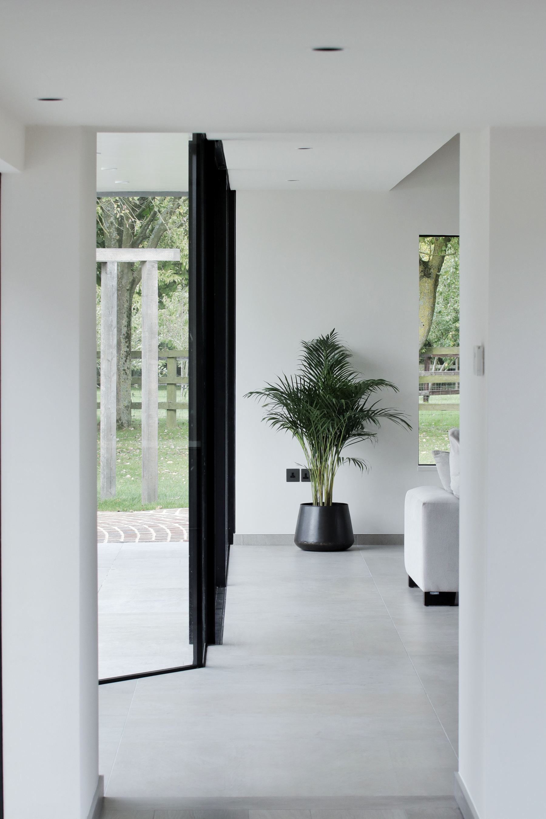 View through glazing to wildflower garden